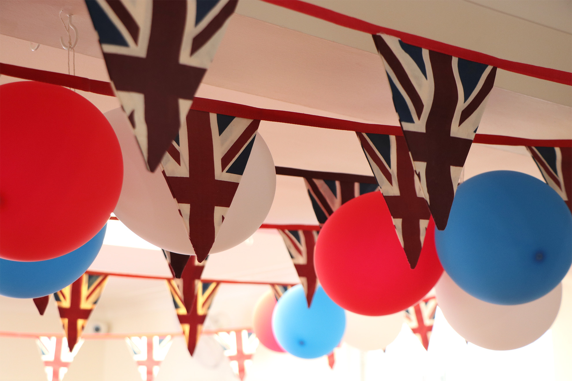 Red, white and blue balloons and British flag bunting decorations